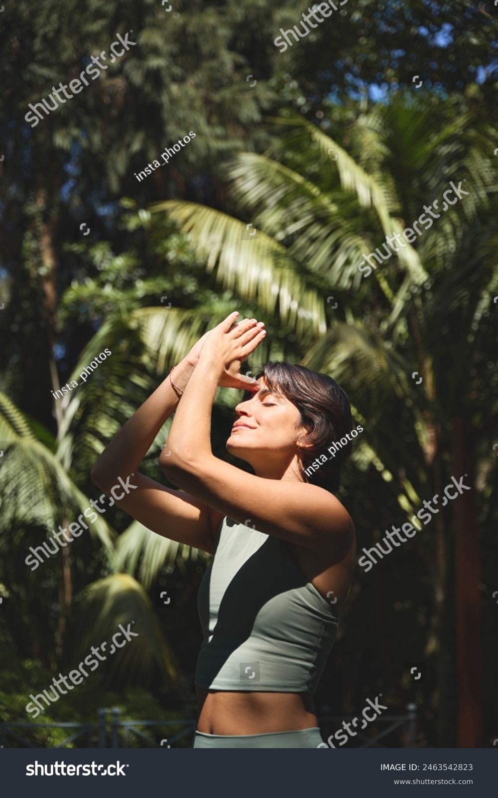 stock-photo-calm-young-hispanic-woman-holding-hands-in-namaste-meditating-doing-yoga-breathing-exercises-with-2463542823